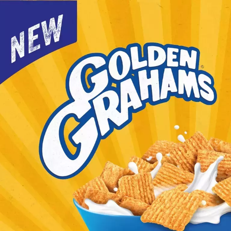 New Golden Grahams in blue bowl with milk